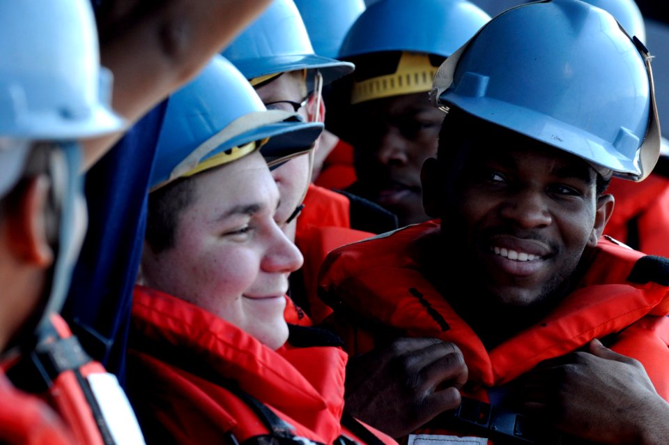 US Navy 100324-N-7478G-370 Culinary Specialist 3rd Class Brandon Troublefield speaks to other members of his work party before a replenishment at sea aboard the U.S. 7th Fleet command ship USS Blue Ridge (LCC 19)
