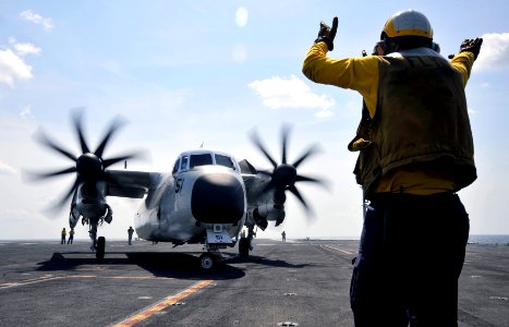 US Navy 100325-N-6003P-799 A C-2A Greyhound assigned to the Rawhides of Fleet Logistics Support Squadron (VRC) 40 is directed into launching position aboard the Nimitz-class aircraft carrier USS Harry S. Truman (CVN 75)