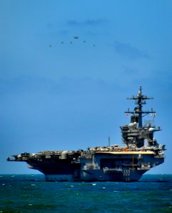 US Navy 100328-N-4774B-076 A formation of FA-18E Super Hornets fly over USS Carl Vinson (CVN 70)