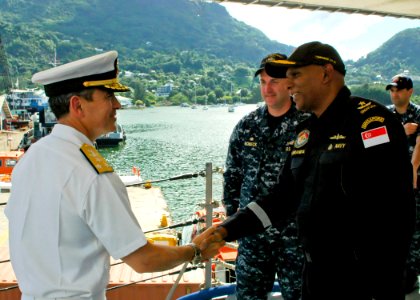 US Navy 100326-N-0000U-001 Vice Adm. Harry B. Harris Jr. shakes hands with Republic of Singapore navy Rear Adm. Bernard Miranda