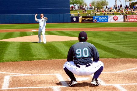 US Navy 100326-N-3271W-082 Rear Adm. Barry L. Bruner, commander of Submarine Group 10 throws out the first pitch before a pre-season game between the Seattle Mariners and Cincinnati Reds at Peoria Sports Complex as part of Phoe
