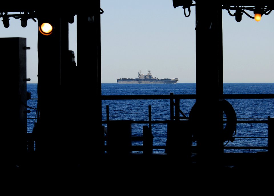 US Navy 100328-N-7948R-309 Amphibious assault ship USS Peleliu (LHA 5) rides alongside amphibious dock landing ship USS Pearl Harbor (LSD 52) off the coast of Southern California