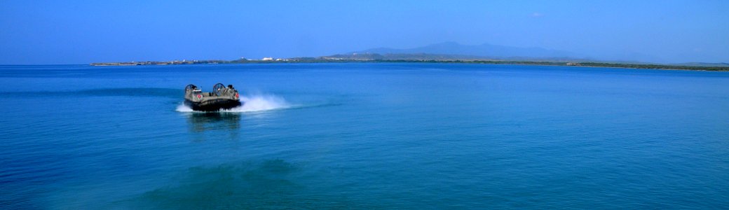 US Navy 100325-N-7508R-289 A landing craft air cushion (LCAC) assigned to Assault Craft Unit (ACU) 4 departs Guantanamo Bay, Cuba
