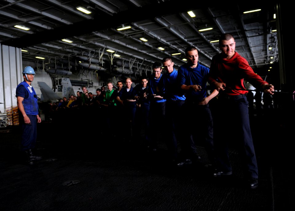 US Navy 100325-N-4236E-041 Sailors heave a line during a replenishment at sea