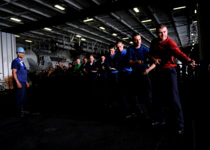 US Navy 100325-N-4236E-041 Sailors heave a line during a replenishment at sea