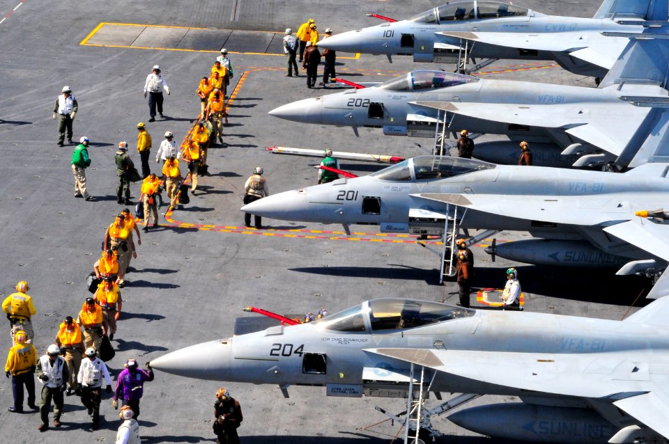 US Navy 100328-N-8878B-050 Peruvian military personnel are escorted across the flight deck aboard the aircraft carrier USS Carl Vinson (CVN 70)