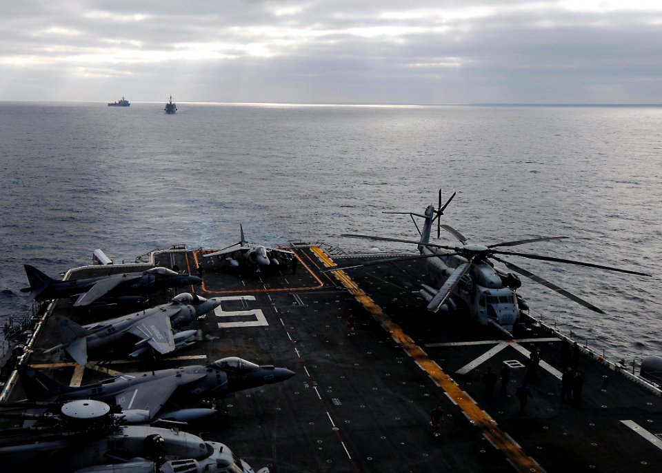 US Navy 100325-N-7948R-207 The amphibious dock landing ship USS Pearl Harbor (LSD 52) and the amphibious transport dock ship USS Dubuque (LPD 8) trail behind the amphibious assault ship USS Peleliu (LHA 5) off the coast of Sout