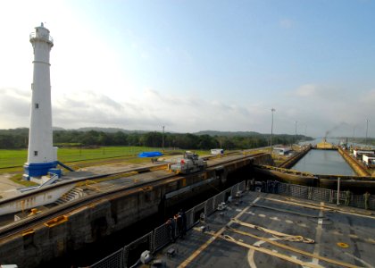 US Navy 100325-N-7058E-100 The littoral combat ship USS Freedom (LCS 1) passes a lighthouse during a transit of the Gatun Locks of the Panama Canal