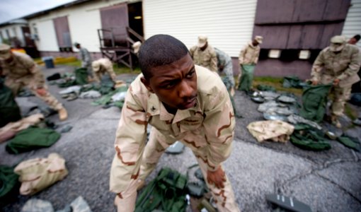 US Navy 100329-N-6932B-257 Information Systems Technician 2nd Class Barron Fludd conducts an inventory of his issued field gear during the U.S. Navy Individual Augmentee Combat Training course at Fort Jackson, S.C