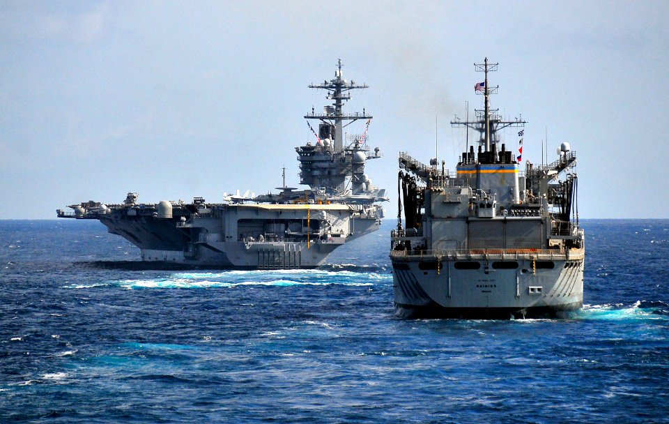 US Navy 100326-N-4774B-106 The Military Sealift Command fast combat support ship USNS Rainier (T-AOE 7) approaches the Nimitz-class aircraft carrier USS Carl Vinson (CVN 70) during an exercise with the guided-missile cruiser US