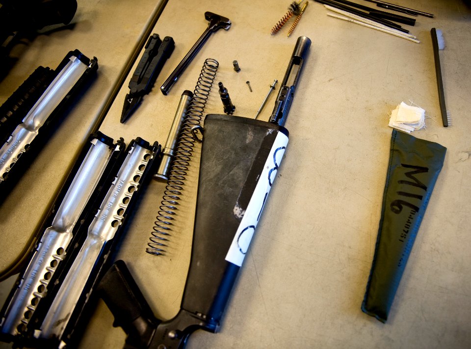 US Navy 100331-N-6932B-321 An M-16 rifle is disassembled for cleaning at the U.S. Navy Individual Augmentee Combat Training course at Fort Jackson, S.C