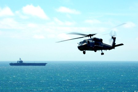 US Navy 100327-N-0808V-032 An SH-60F Sea Hawk, attached to Helicopter Anti-Submarine Squadron (HS) 15, flies as part of a flight demonstration for Peruvian guests aboard the aircraft carrier USS Carl Vinson (CVN 70)