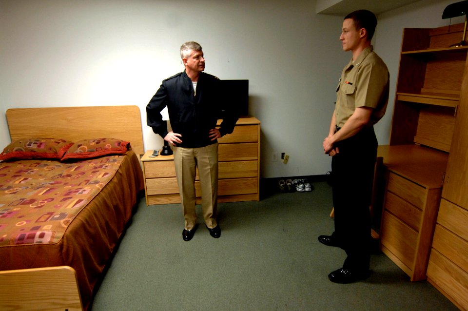 US Navy 100331-N-9818V-032 Master Chief Petty Officer of the Navy (MCPON) Rick West tours the room of Cryptologic Technician (Interpretive) 3rd Class Alex Pototsky during his tour of the barracks at Navy Information Operations