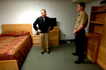 US Navy 100331-N-9818V-032 Master Chief Petty Officer of the Navy (MCPON) Rick West tours the room of Cryptologic Technician (Interpretive) 3rd Class Alex Pototsky during his tour of the barracks at Navy Information Operations