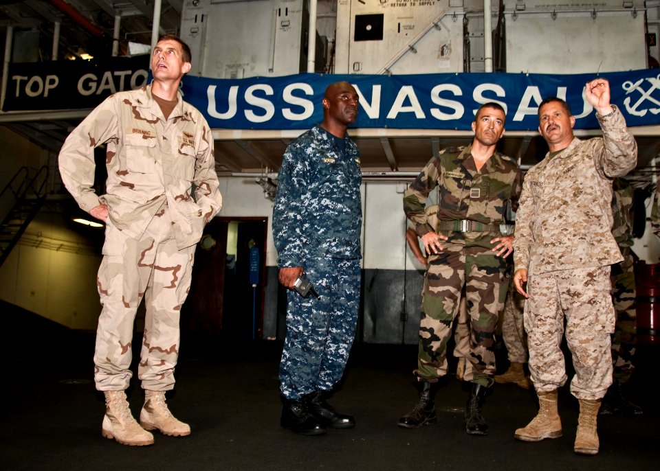 US Navy 100331-N-8936G-222 Officers speak in Nassau's hangar bay