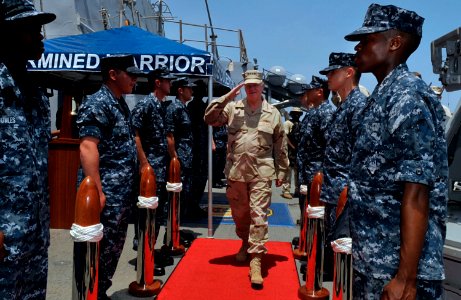 US Navy 100326-N-8273J-039 Chief of Naval Operations (CNO) Adm. Gary Roughead arrives aboard the guided-missile destroyer USS COLE (DDG 67) to visit with Sailors and senior military leaders
