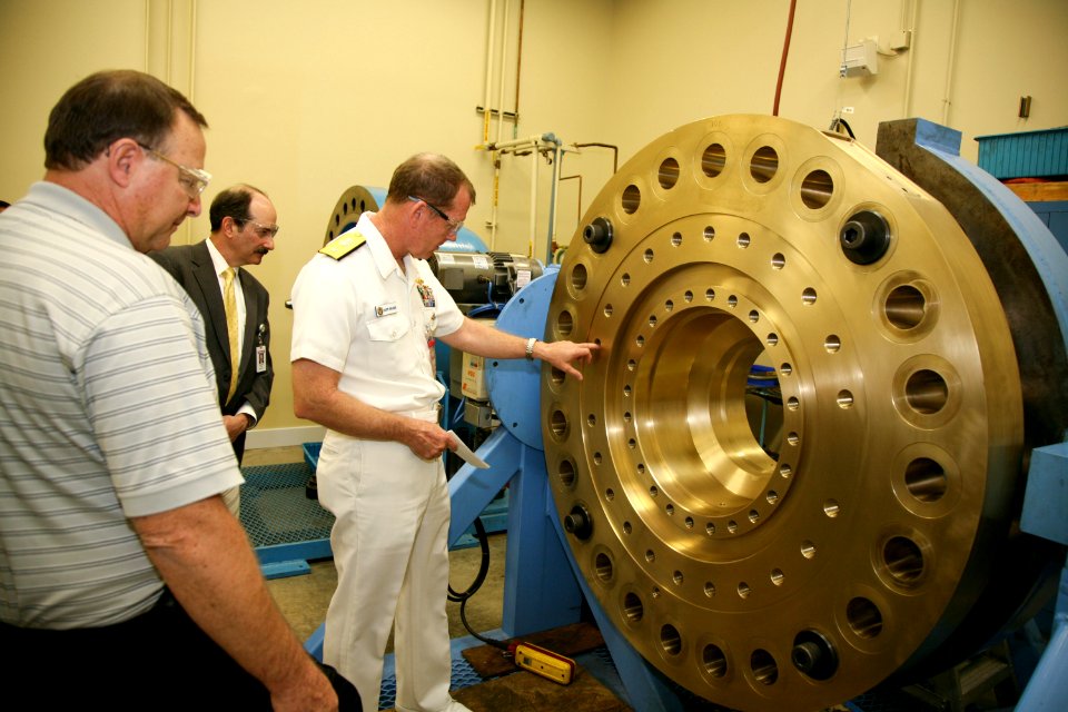 US Navy 100329-N-3271W-072 Rear Adm. Barry L. Bruner, commander of Submarine Group 10, tours Honeywell, a manufacturer of civil and military avionics and other aerospace products.