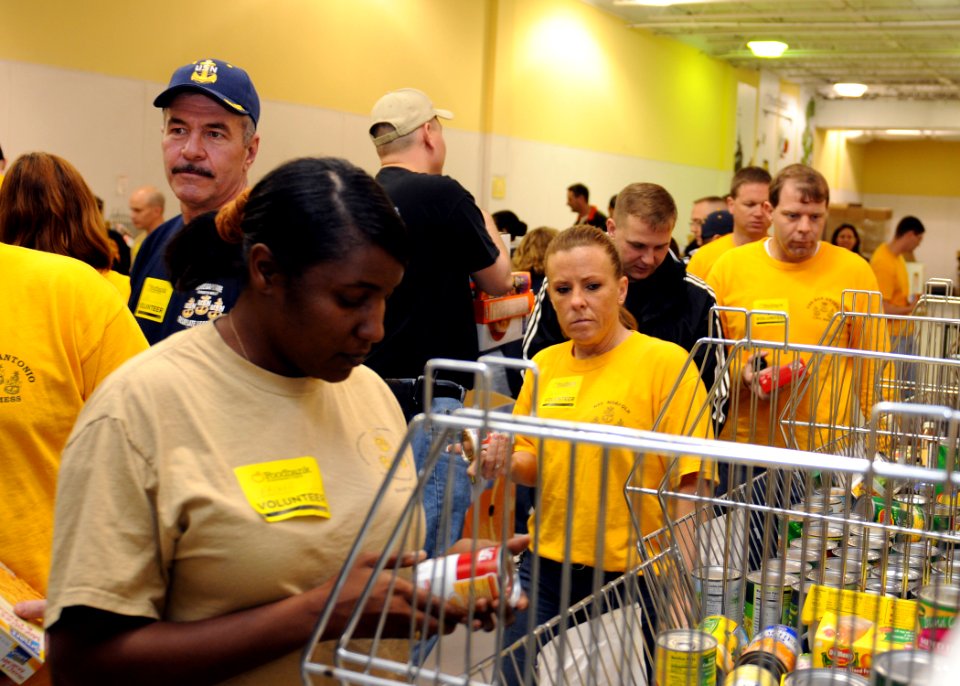 US Navy 100329-N-3165S-007 Chief petty officers from the Hampton Roads area volunteer their time at the food bank of Southeastern Virginia, sorting food products to be delivered to those in need
