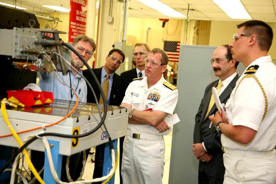 US Navy 100329-N-3271W-079 Rear Adm. Barry L. Bruner, commander of Submarine Group 10, tours Honeywell, a manufacturer of civil and military avionics and other aerospace products
