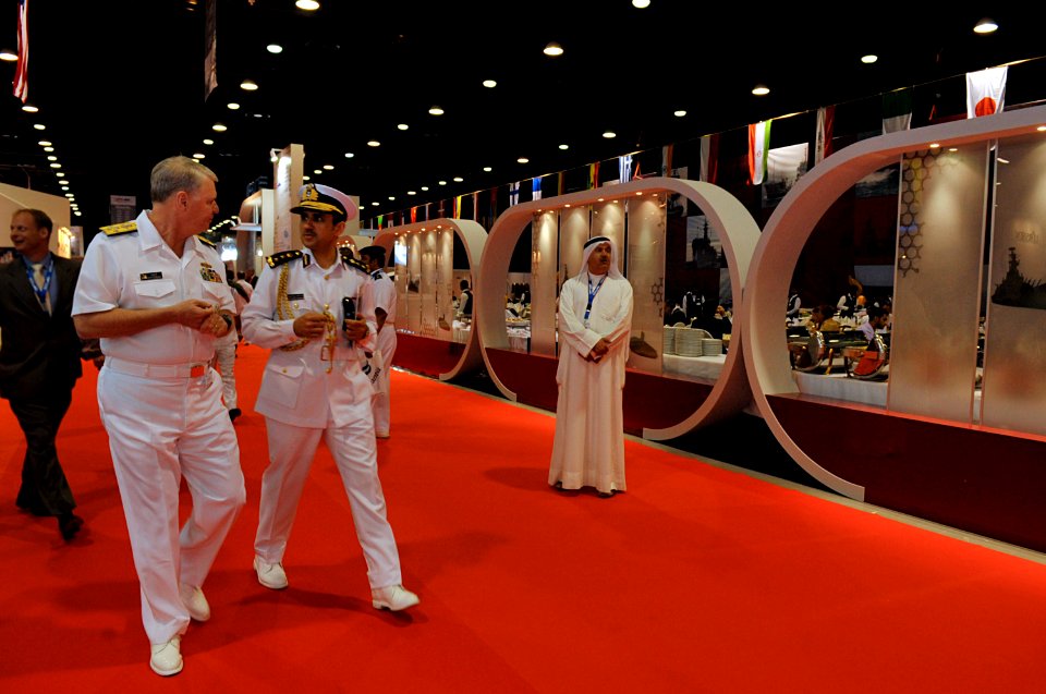 US Navy 100330-N-8273J-050 Chief of Naval Operations (CNO) Adm. Gary Roughead speaks with Qatari Col. Abdullah Eid Al-Bourdainiby at the Doha International Maritime Defense Exhibition (DIMDEX) Mid East Naval Commander's Confere