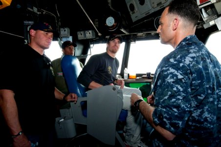 US Navy 100328-N-2735T-059 New Orleans Saints tight end Billy Miller, Kansas City Chiefs linebacker Donnie Edwards, and New Orleans Saints quarterback Drew Brees visit USS Nassau (LHA 4) during a USO Tour