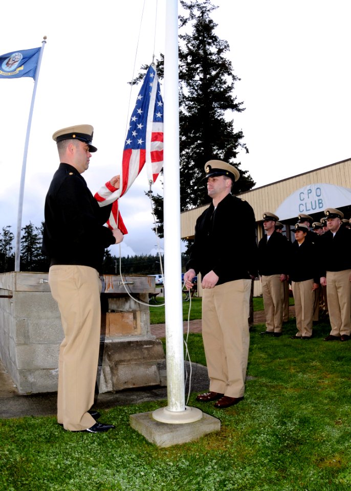 US Navy 100401-N-9860Y-002 Chief Master-at-Arms Eric Wynn and Chief Air Traffic Controller Brian Armstrong conduct morning colors during a ceremony commemorating the 117th anniversary of the chief petty officer rank