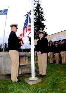 US Navy 100401-N-9860Y-002 Chief Master-at-Arms Eric Wynn and Chief Air Traffic Controller Brian Armstrong conduct morning colors during a ceremony commemorating the 117th anniversary of the chief petty officer rank photo