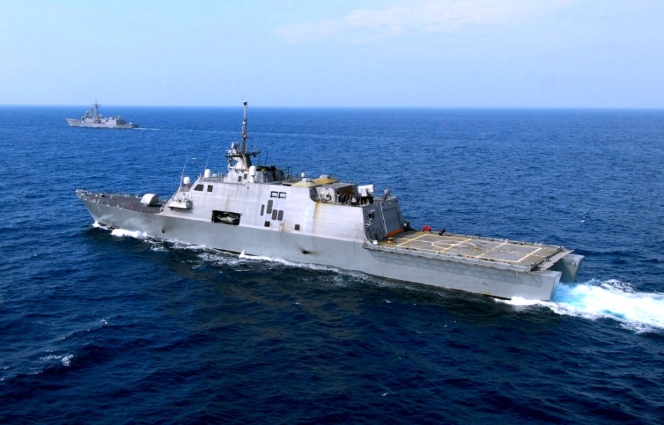 US Navy 100330-N-7058E-372 USS Freedom (LCS 1) maneuvers off the port quarter of the guided-missile frigate USS McInerney (FFG 8) during joint counter-illicit trafficking operations in the U.S. 4th Fleet area of responsibility