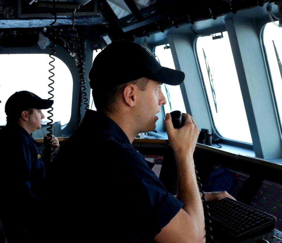 US Navy 100402-N-7653W-060 Lt. j.g. Justin Guernsey communicates on the ship's VHF radio while standing watch on the bridge of the littoral combat ship USS Independence (LCS 2)