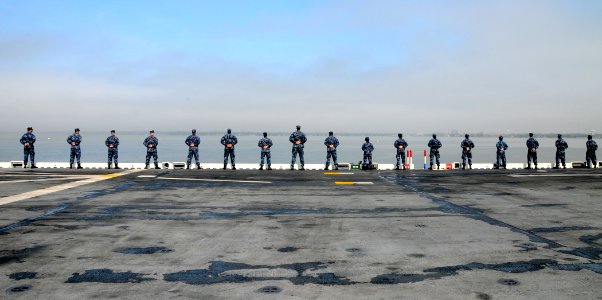 US Navy 100403-N-7508R-013 Sailors man the rails aboard USS Bataan (LHD 5)