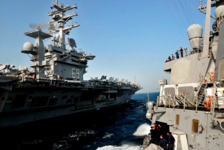 US Navy 100330-N-3595W-005 USS Dwight D. Eisenhower (CVN 69) cruises alongside USS Carney (DDG 64) during a refueling at sea