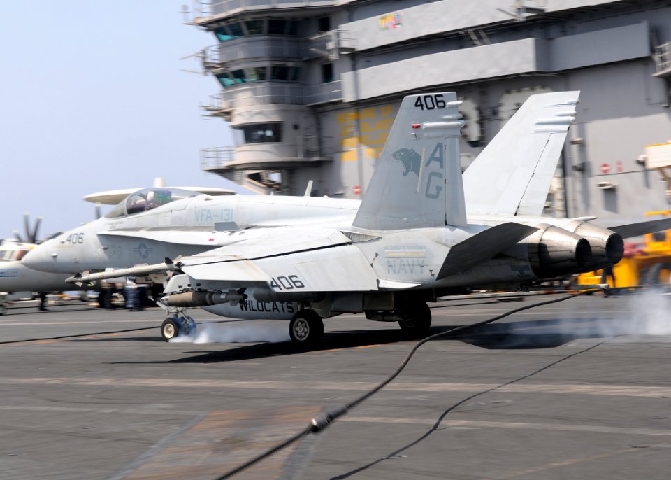 US Navy 100329-N-4236E-142 An F-A-18E Super Hornet assigned to the Pukin Dogs of Strike Fighter Squadron (VFA) 143 catches an arresting wire