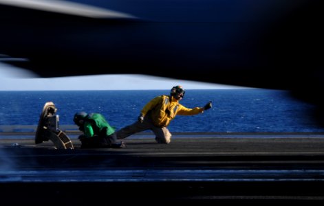 US Navy 100331-N-2858S-035 A Shooter launches an F-A-18E Super Hornet from the flight deck of SS Harry S. Truman (CVN 75)