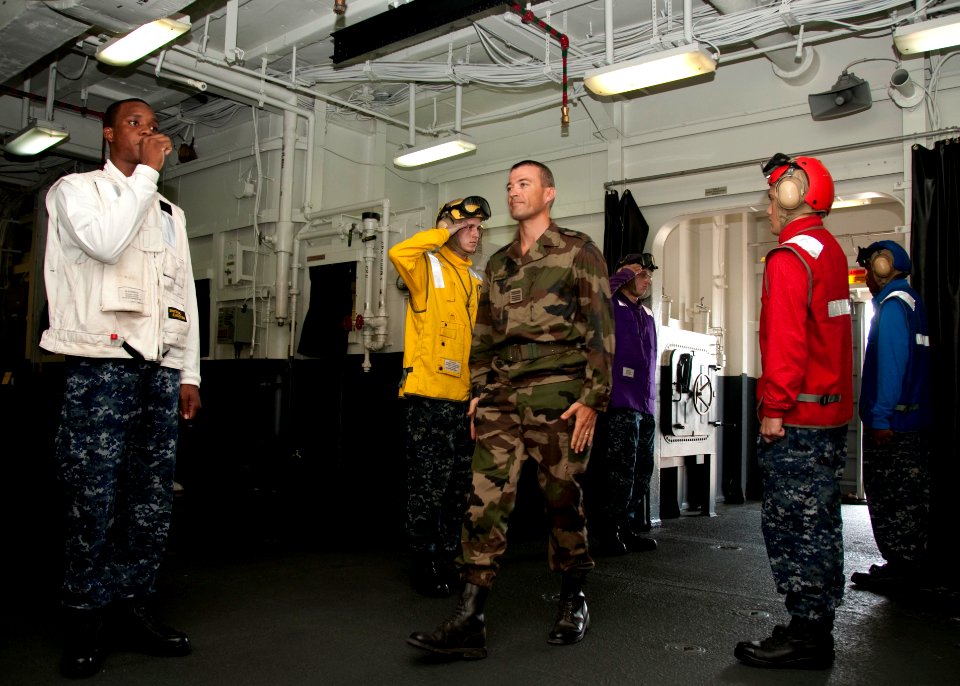 US Navy 100331-N-8936G-002 Col. Thierry Burkhard, commanding officer of the 13th Foreign Legion Demi Brigade, is piped aboard the amphibious assault ship USS Nassau (LHA 4)