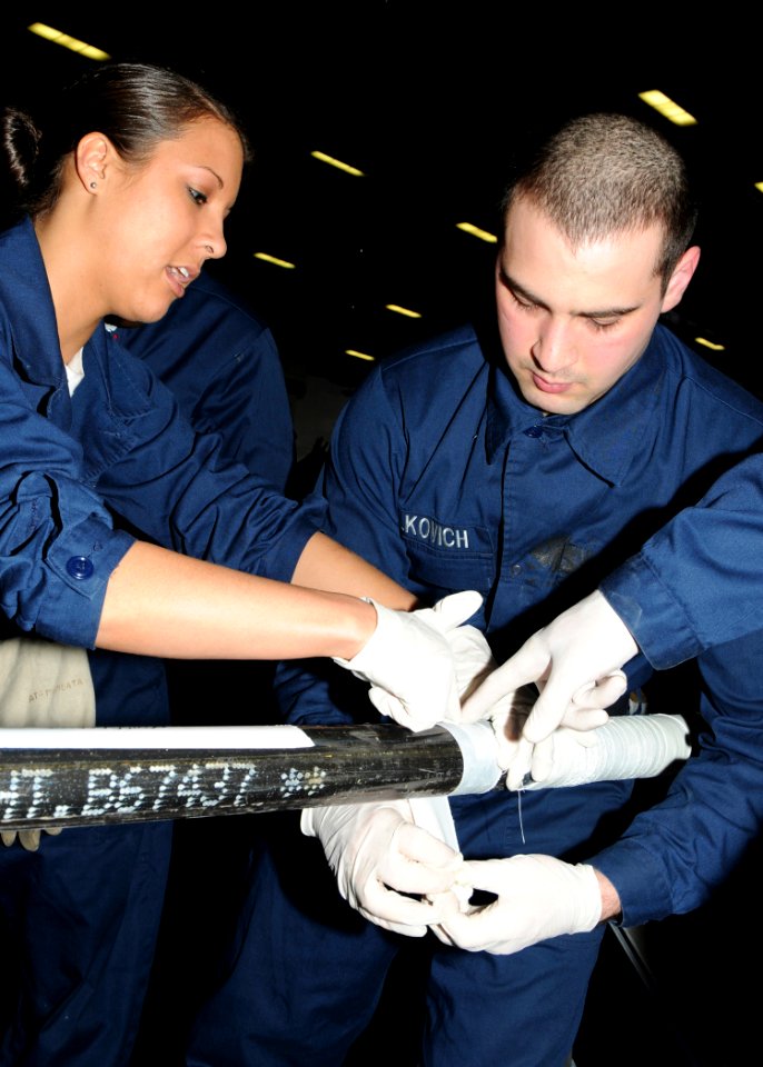 US Navy 100403-N-9116S-056 Sailors aboard USS George H.W. Bush (CVN 77) practice pipe patching during a damage control olympics