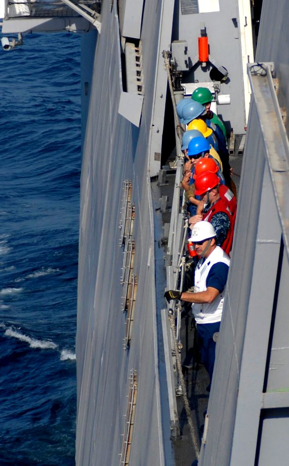 US Navy 100405-N-3358S-006 Deck department Sailors aboard the amphibious transport dock ship USS Mesa Verde (LPD 19) prepare for an underway replenishment with the Military Sealift Command dry cargo and ammunition ship USNS Rob