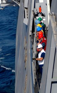 US Navy 100405-N-3358S-006 Deck department Sailors aboard the amphibious transport dock ship USS Mesa Verde (LPD 19) prepare for an underway replenishment with the Military Sealift Command dry cargo and ammunition ship USNS Rob
