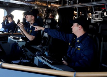 US Navy 100402-N-7653W-050 Chief Quatermaster Tyler Smith points to a surface contact on the bridge of the littoral combat ship USS Independence (LCS 2) as the ship makes her way to Mayport, Fla