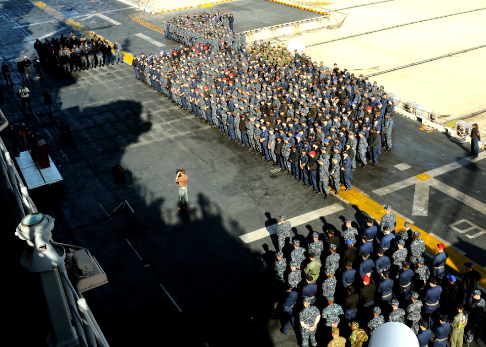 US Navy 100402-N-4649B-030 Capt. Tom Negus speaks to the crew of USS Bataan (LHD 5) on the ship's flight deck