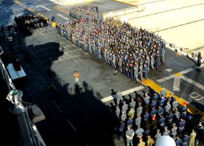 US Navy 100402-N-4649B-030 Capt. Tom Negus speaks to the crew of USS Bataan (LHD 5) on the ship's flight deck