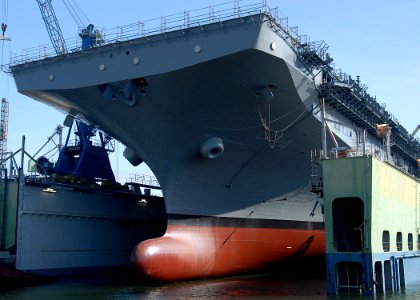 US Navy 100401-N-8283S-034 Water reaches the keel of the amphibious assault ship USS Boxer (LHD 4) during the submerging of the National Steel and Shipbuilding Company floating dry dock