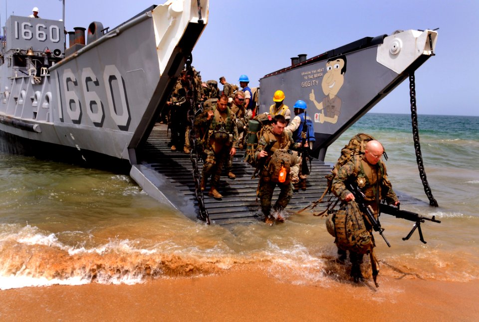 US Navy 100406-N-7948C-337 U.S. Marines assigned to Security Cooperation Marine Air-Ground Task Force (SC-MAGTF) disembark Landing Craft Utility (LCU) 1660