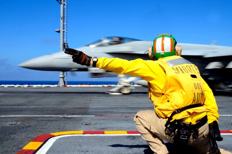 US Navy 100403-N-6006S-070 Lt. Edward Morelli launches an F-A-18 Super Hornet from the flight deck of the Nimitz-class aircraft carrier USS Carl Vinson (CVN 70)