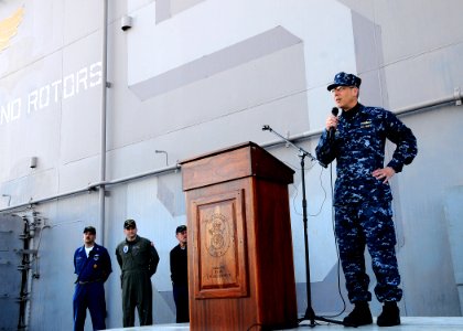US Navy 100402-N-7508R-100 Capt. Tom Negus speaks to the crew of USS Bataan (LHD 5) during an all-hands call on the ship's flight deck. on the ship's flight deck