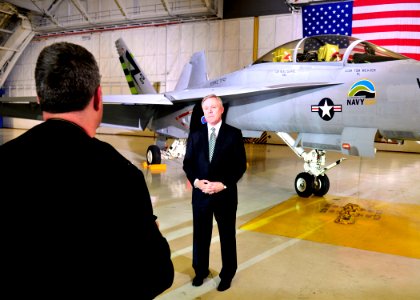 US Navy 100331-N-9565D-302 Secretary of the Navy (SECNAV) the Honorable Ray Mabus, with the Navy's F-A-18 Green Hornet, speaks with reporters about the Navy's F-A-18 Green Hornet following a speech by President Barack Obama