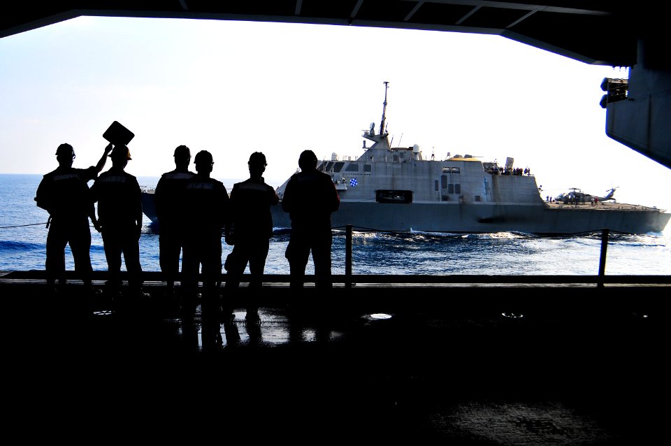 US Navy 100407-N-8878B-094 Sailors watch as the littoral combat ship USS Freedom (LCS 1) conducts a refueling at sea with the Nimitz-class aircraft carrier USS Carl Vinson (CVN 70)