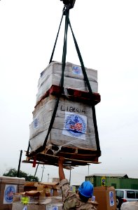 US Navy 100403-N-6676S-133 Project Handclasp material is craned onto the pier in Liberia