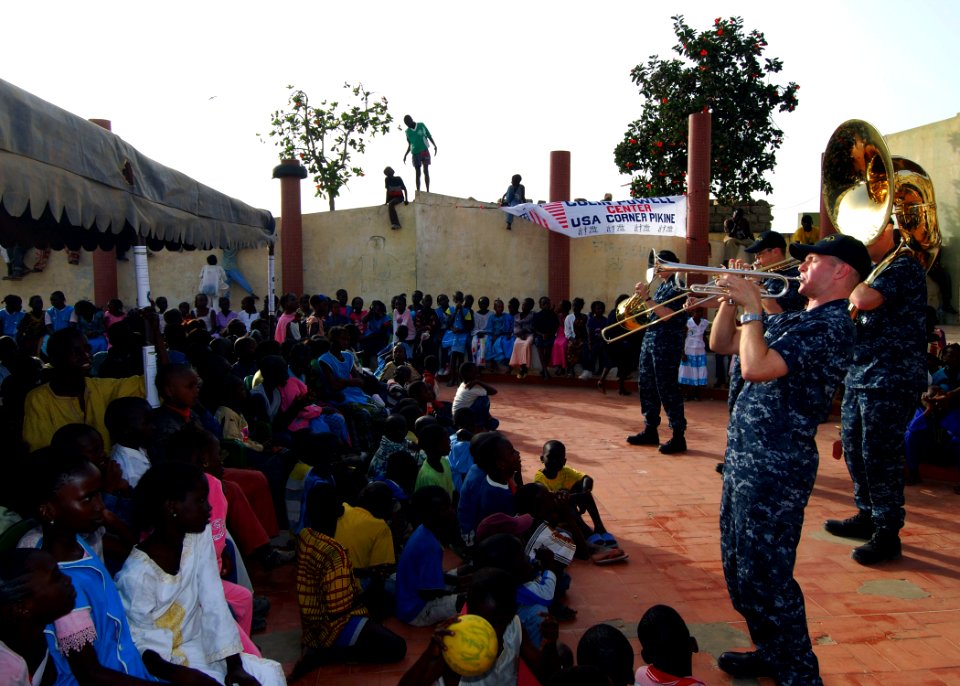 US Navy 100408-N-6138K-189 Musician 2nd Class Justin Strauss performs for more than 300 children at the Colin Powell Cultural Center