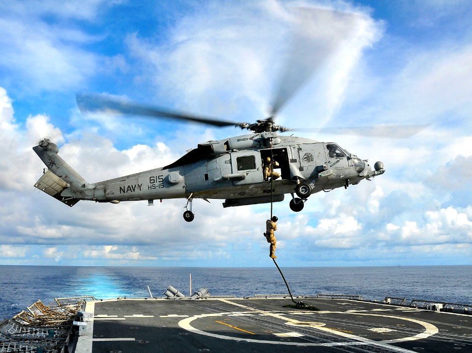 US Navy 100406-N-4774B-259 A member of Explosive Ordnance Disposal Mobile Unit (EODMU) 3 repels aboard USS Bunker Hill (CG 52)