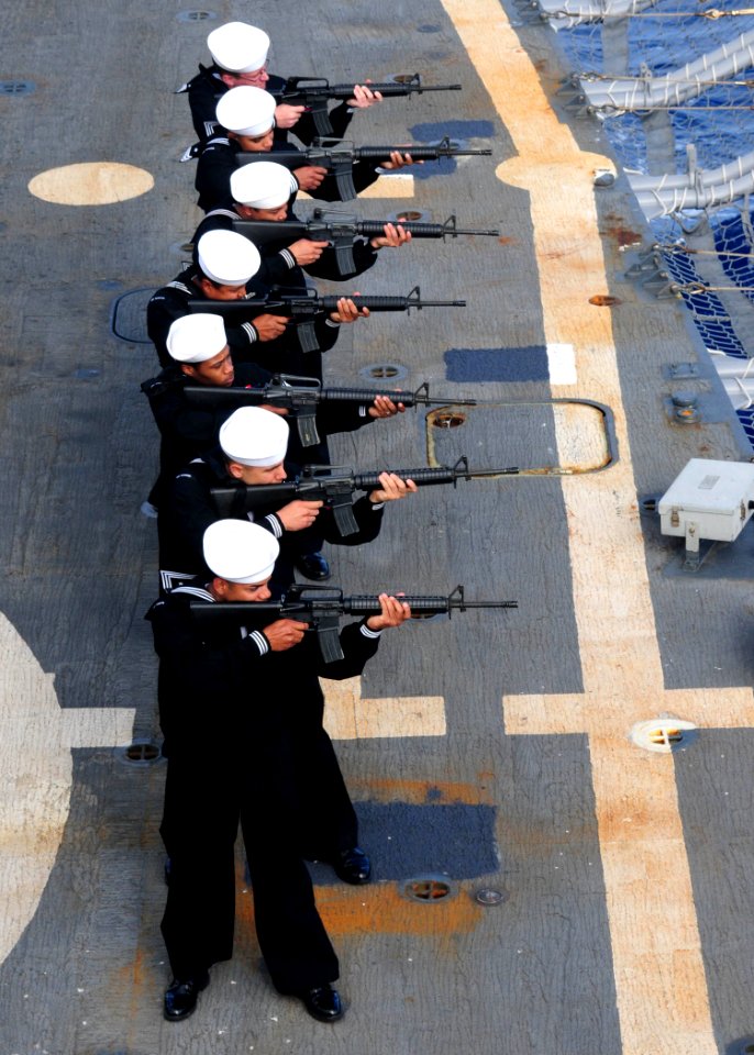 US Navy 100407-N-9301W-221 Sailors aboard the guided-missile frigate USS Klakring (FFG 42) fire a rifle volley during a burial at sea